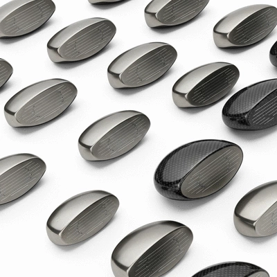 Modern golf club heads made of titanium and carbon fiber on a clean white background