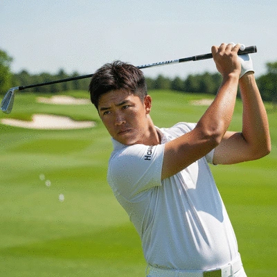 Golfer focusing intently on the golf ball before a swing, showing deep concentration and mental resilience, no text, no words, no typography, clean image