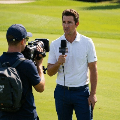 Professional golfer being interviewed on a green golf course, natural lighting, high resolution